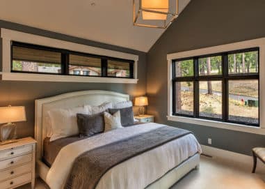 Bedroom with three panel windows